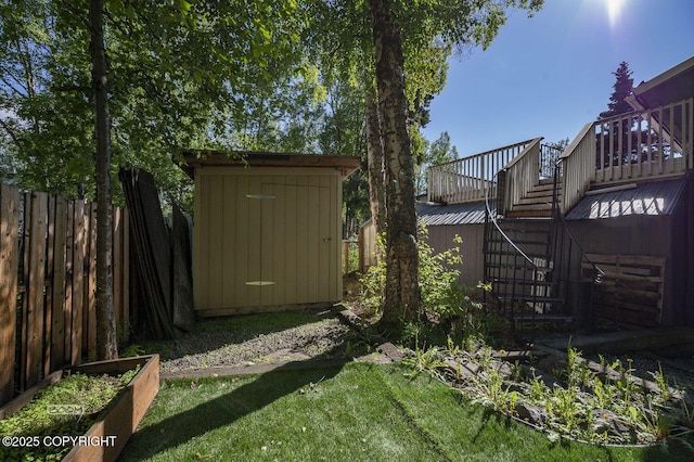 13311 Cove Cir, Anchorage, AK 99515 - view of yard featuring stairway, a shed, and a wooden deck
