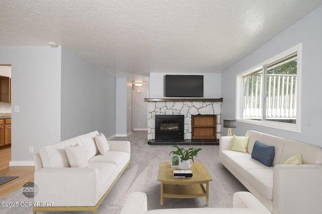 13311 Cove Cir, Anchorage, AK 99515 - living area featuring a fireplace and a textured ceiling