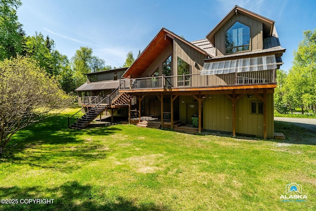 14901 Terrrace Ln, Eagle River, AK 99577 - back of house featuring a deck, stairs, and a lawn