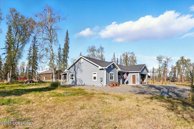 47974 Barney Ct, Soldotna, AK 99669 - view of home's exterior featuring driveway and a lawn