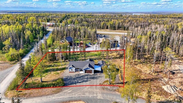 47974 Barney Ct, Soldotna, AK 99669 - aerial view of property and surrounding area featuring a heavily wooded area and property parcel outlined