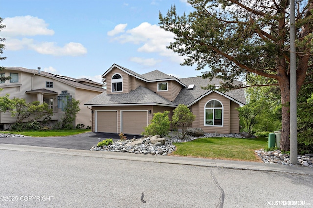 18704 Snowy Plover Cir, Anchorage, AK 99516 - traditional-style home with roof with shingles, driveway, a garage, and a front yard