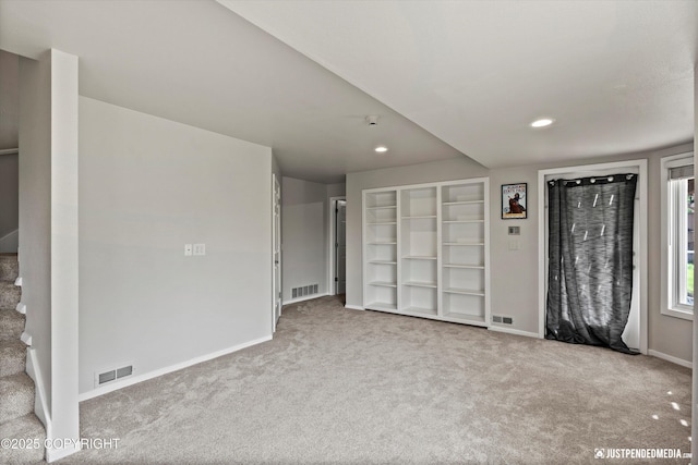 18704 Snowy Plover Cir, Anchorage, AK 99516 - entrance foyer featuring carpet floors, baseboards, recessed lighting, and stairway