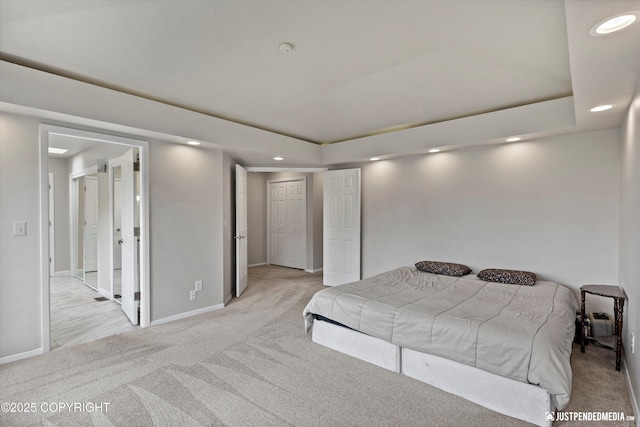 18704 Snowy Plover Cir, Anchorage, AK 99516 - bedroom featuring light carpet, recessed lighting, baseboards, and a tray ceiling