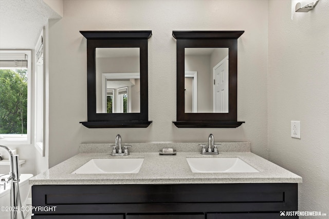 18704 Snowy Plover Cir, Anchorage, AK 99516 - bathroom featuring double vanity and toilet