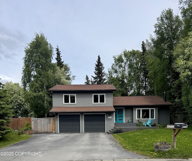 13521 Ebbtide Cir, Anchorage, AK 99516 - split level home featuring asphalt driveway and a garage