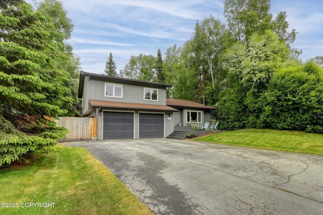 13521 Ebbtide Cir, Anchorage, AK 99516 - split level home with asphalt driveway and a garage