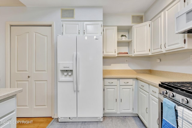 13521 Ebbtide Cir, Anchorage, AK 99516 - kitchen with white appliances, open shelves, and light countertops