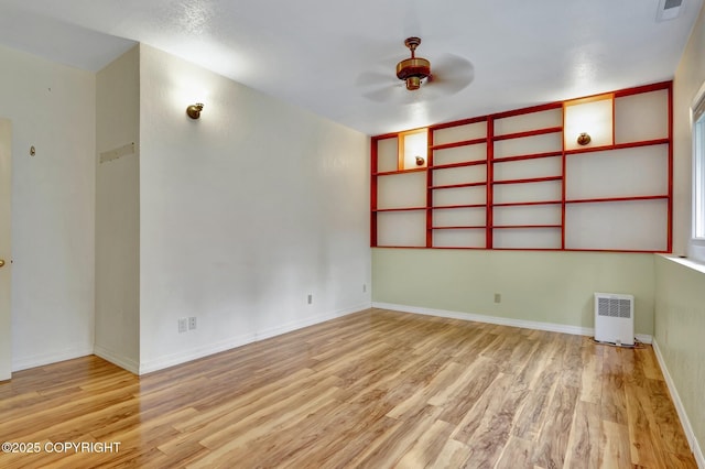 13521 Ebbtide Cir, Anchorage, AK 99516 - empty room featuring a ceiling fan, light wood-type flooring, and baseboards