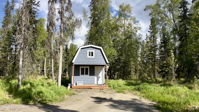 52056 Zircon Ct, Nikiski/North Kenai, AK 99611 - view of outbuilding featuring a forest view