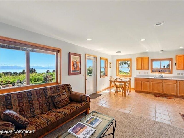 58820 E End Rd, Homer, AK 99603 - living area with light tile patterned floors, recessed lighting, and baseboards
