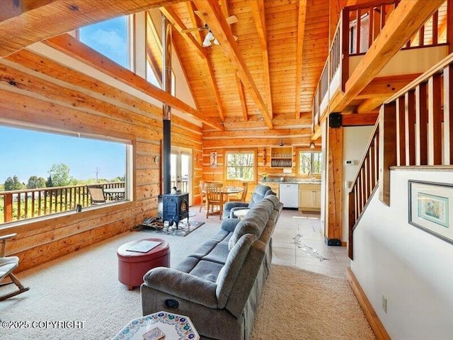 58820 E End Rd, Homer, AK 99603 - living area with a wood stove, wooden ceiling, and stairs