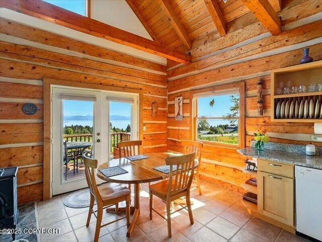 58820 E End Rd, Homer, AK 99603 - dining area featuring french doors, plenty of natural light, light tile patterned floors, wooden ceiling, and a wood stove