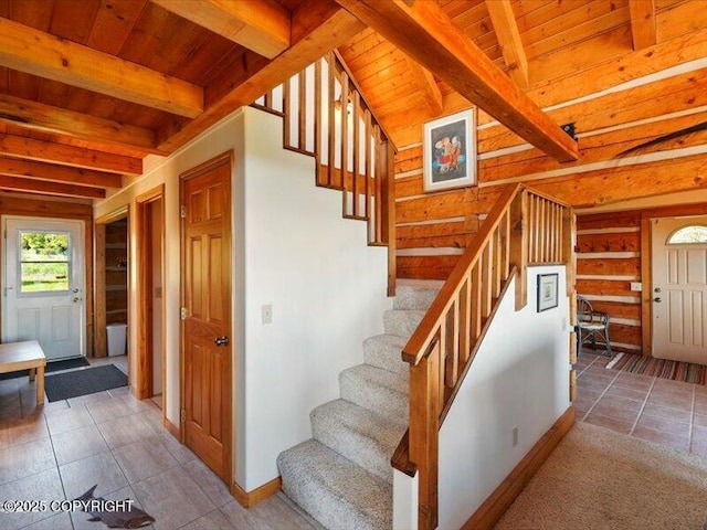 58820 E End Rd, Homer, AK 99603 - stairway with wood ceiling with exposed beams, baseboards, and tile patterned flooring
