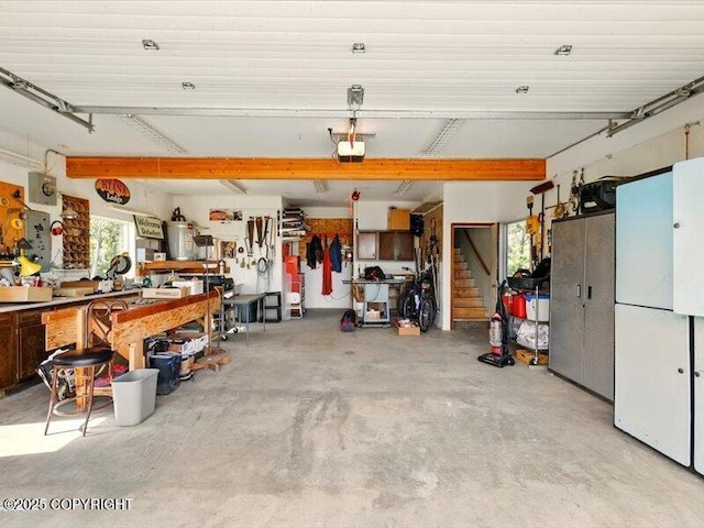 58820 E End Rd, Homer, AK 99603 - garage with a workshop area and a garage door opener