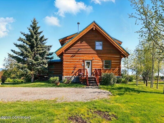 58820 E End Rd, Homer, AK 99603 - view of front of house with a front yard and log siding