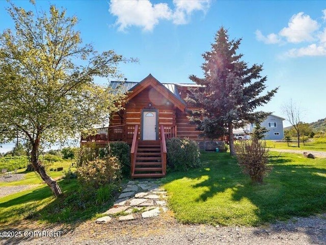 58820 E End Rd, Homer, AK 99603 - cabin featuring a front lawn