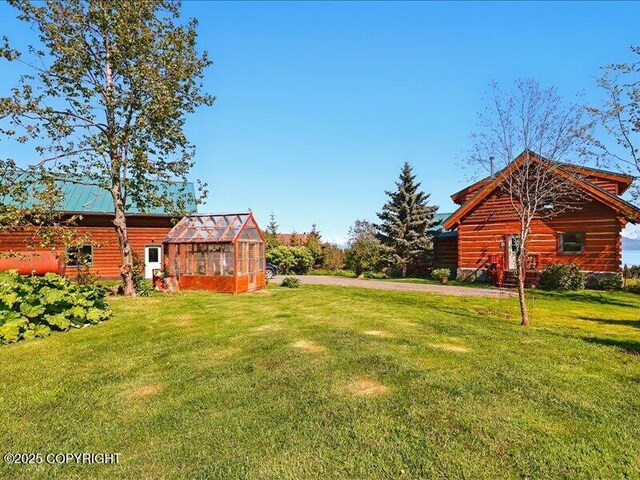 58820 E End Rd, Homer, AK 99603 - view of grassy yard featuring an exterior structure and an outdoor structure