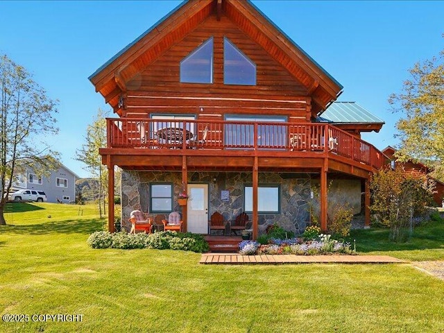 58820 E End Rd, Homer, AK 99603 - rear view of house with stone siding, a deck, and a yard
