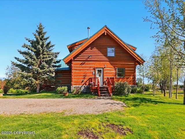 58820 E End Rd, Homer, AK 99603 - view of front of house featuring a front lawn and log exterior