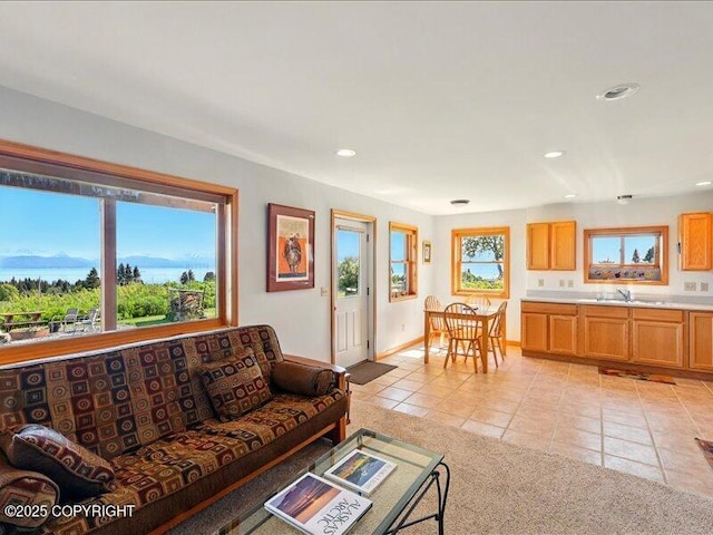 58820 E End Rd, Homer, AK 99603 - living area with light tile patterned floors, recessed lighting, and baseboards