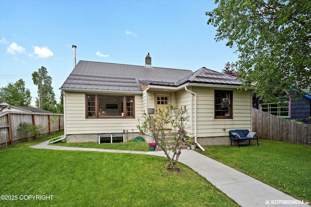 1310 G St, Anchorage, AK 99501 - bungalow-style home featuring a chimney, metal roof, and a standing seam roof