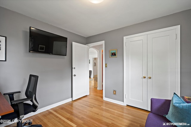 1310 G St, Anchorage, AK 99501 - office space featuring baseboards, light wood-style flooring, and arched walkways