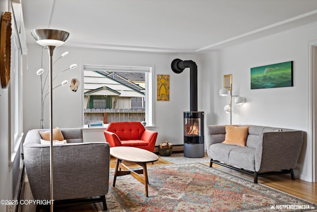 1310 G St, Anchorage, AK 99501 - living area with a wood stove, wood finished floors, and ornamental molding