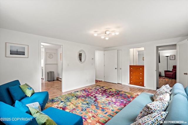 1310 G St, Anchorage, AK 99501 - living area with light wood-style flooring and baseboards