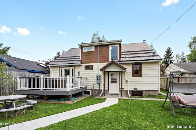1310 G St, Anchorage, AK 99501 - back of property with a deck and metal roof