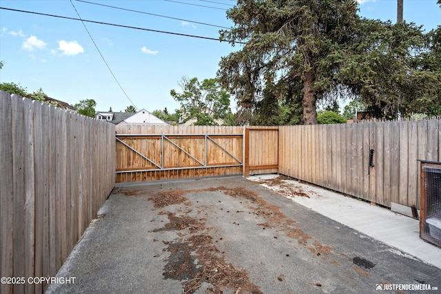 1310 G St, Anchorage, AK 99501 - fenced backyard featuring a patio area and a gate