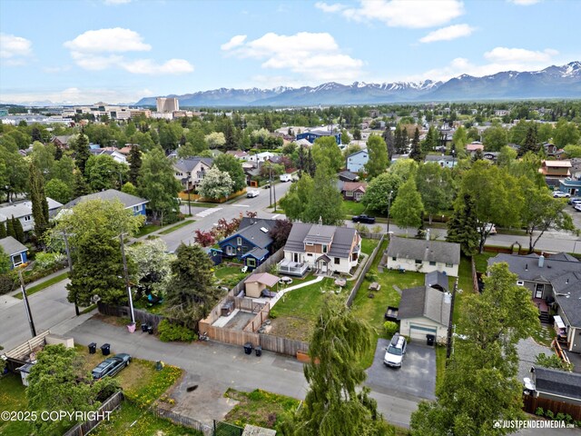 1310 G St, Anchorage, AK 99501 - aerial overview of property's location with nearby suburban area and a mountain backdrop