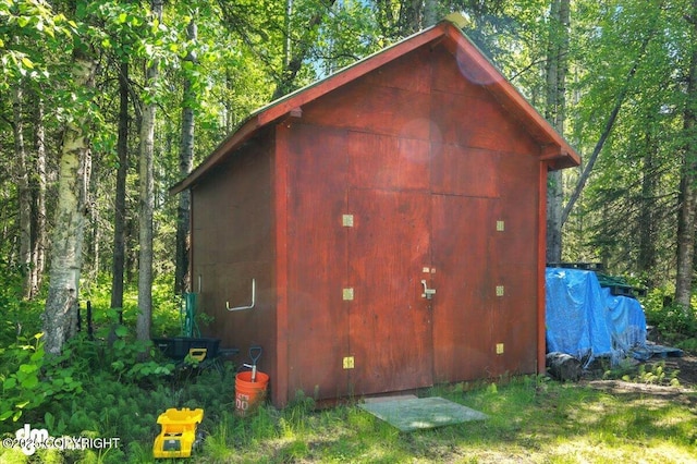 3470 W Wren St, Wasilla, AK 99623 - view of outdoor structure featuring a wooded view