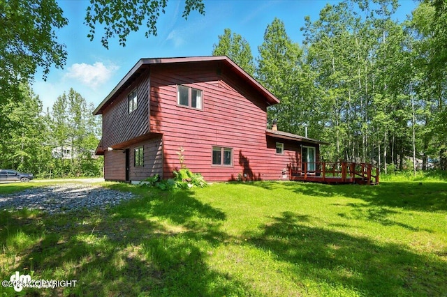 3470 W Wren St, Wasilla, AK 99623 - view of property exterior featuring a wooden deck and a yard