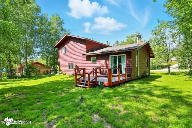 3470 W Wren St, Wasilla, AK 99623 - back of house with a deck and a yard