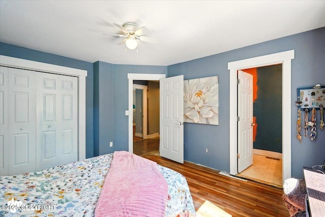 3470 W Wren St, Wasilla, AK 99623 - bedroom with wood finished floors, a closet, and a ceiling fan