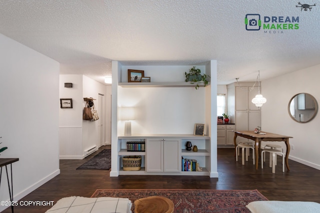 190 Grand Larry St Unit A-01, Anchorage, AK 99504 - living area with a textured ceiling, a baseboard heating unit, and dark wood finished floors