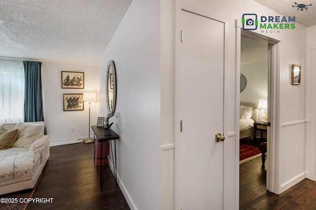 190 Grand Larry St Unit A-01, Anchorage, AK 99504 - hallway featuring a textured ceiling and dark wood-style flooring