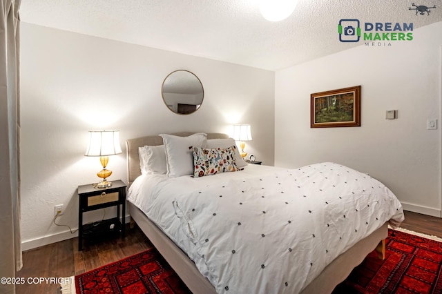 190 Grand Larry St Unit A-01, Anchorage, AK 99504 - bedroom with wood finished floors and a textured ceiling