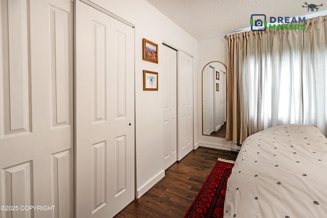 190 Grand Larry St Unit A-01, Anchorage, AK 99504 - bedroom with dark wood finished floors and a textured ceiling