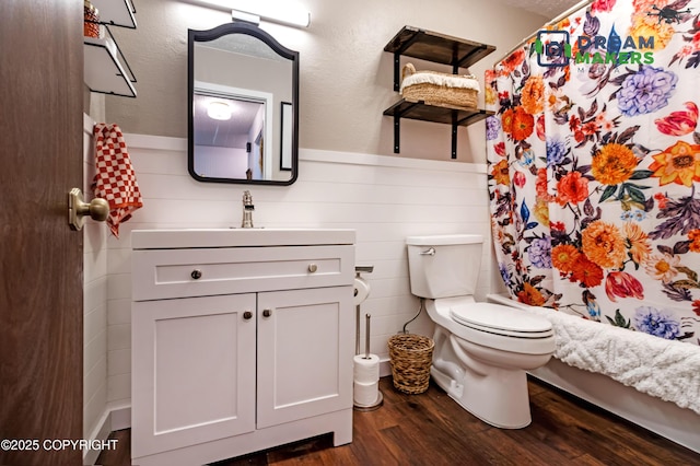 190 Grand Larry St Unit A-01, Anchorage, AK 99504 - bathroom with wood finished floors, vanity, wainscoting, and shower / bath combination with curtain
