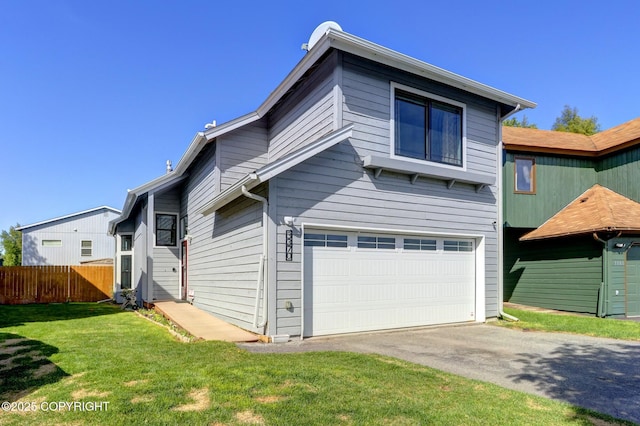 3370 Chaparral Cir, Anchorage, AK 99502 - back of house featuring a garage and asphalt driveway