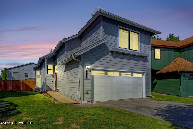 3370 Chaparral Cir, Anchorage, AK 99502 - view of side of property featuring an attached garage and asphalt driveway