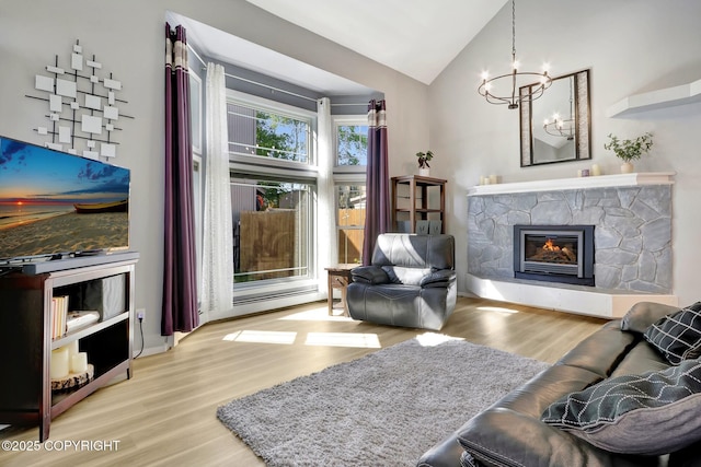 3370 Chaparral Cir, Anchorage, AK 99502 - living area with wood finished floors, a chandelier, vaulted ceiling, a stone fireplace, and baseboards