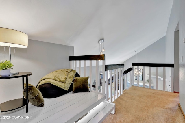 3370 Chaparral Cir, Anchorage, AK 99502 - stairway featuring carpet floors and vaulted ceiling