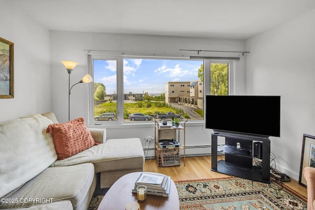 824 O Pl, Anchorage, AK 99501 - living room with wood finished floors and a baseboard radiator