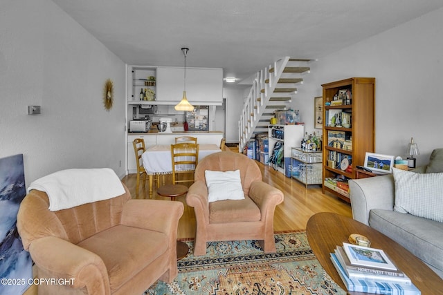 824 O Pl, Anchorage, AK 99501 - living area featuring stairs and wood finished floors