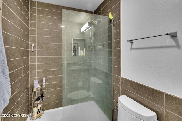 824 O Pl, Anchorage, AK 99501 - full bathroom with toilet and tile walls