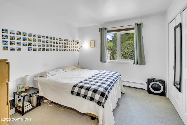 824 O Pl, Anchorage, AK 99501 - bedroom featuring baseboard heating and carpet floors