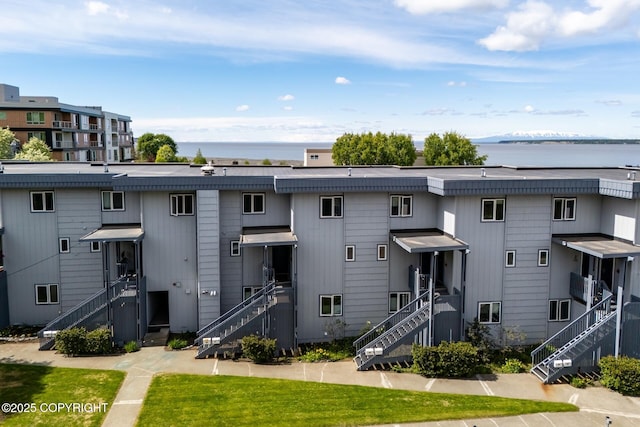 824 O Pl, Anchorage, AK 99501 - view of property featuring stairway and a water view